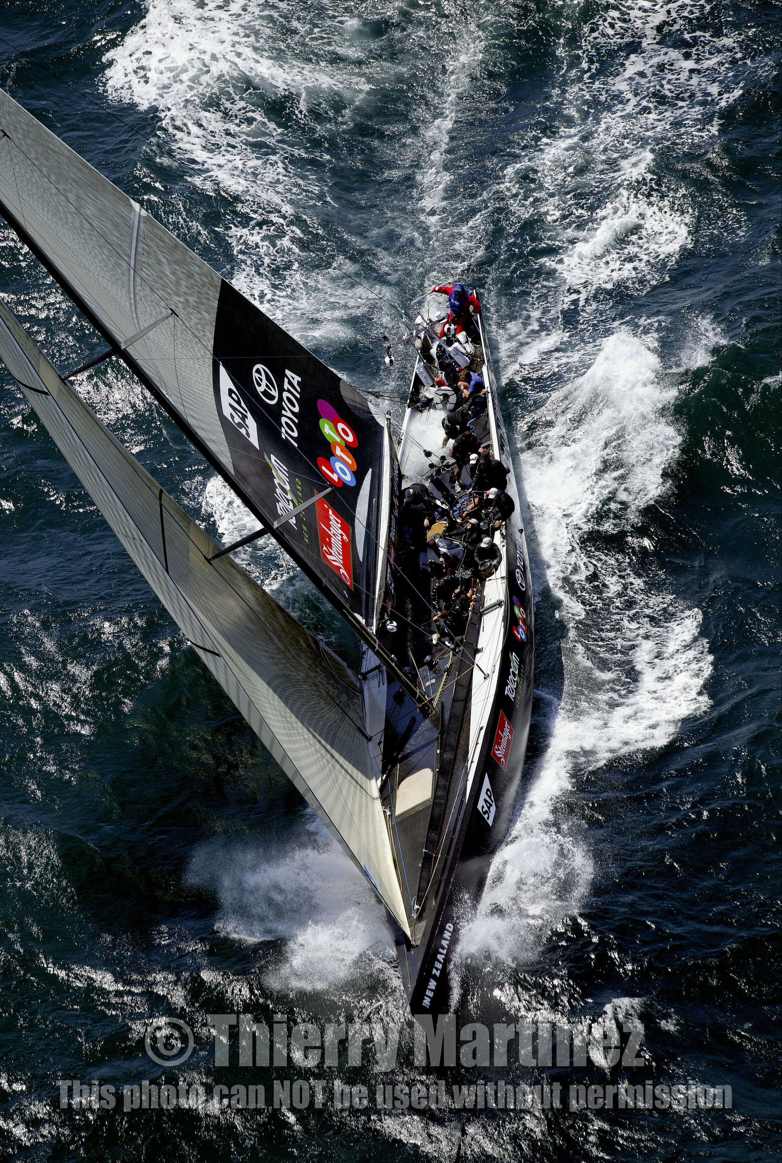03_0158D ©Th.Martinez - Auckland (NZ) . America's Cup 2003. 15th February 2003. Day 1..Alinghi (SUI 64) vs Team NZ (NZL 82) .NZL 82 in first minutes of Race 1 before retiring on damage. Alinghi 1- Team NZ 0.