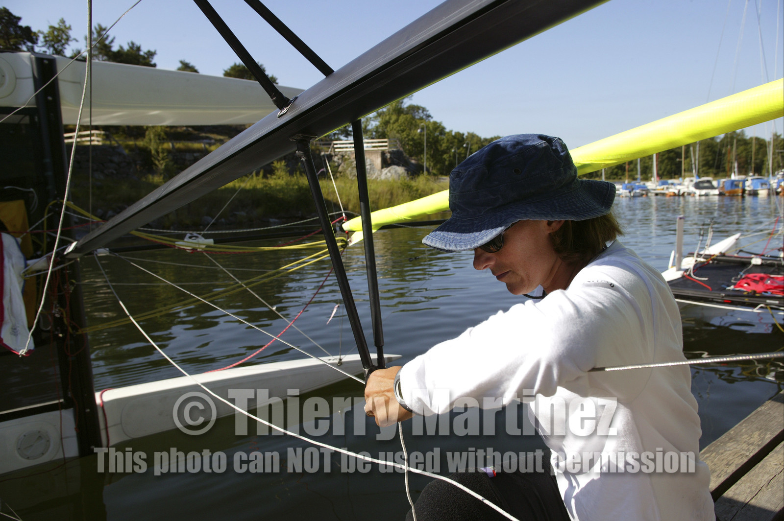 03_3022D © Th.Martinez,STOCKHOLM ARCHIPELAGO SWEDEN, 8 07 03-Archipelago Raid (2003)  Day 1..Lisa  McDonald (UK) preparing her boat (ASSA ABLOY) before leg1.