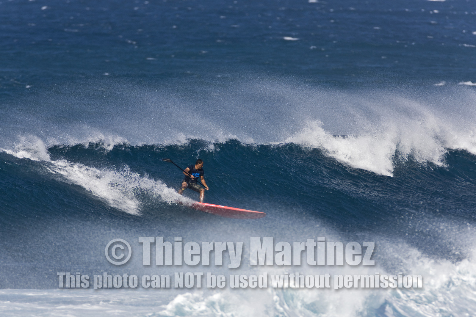 Stand Up Paddle  in waves at Hookip'a Beach - North Shore Maui - Hawaii.