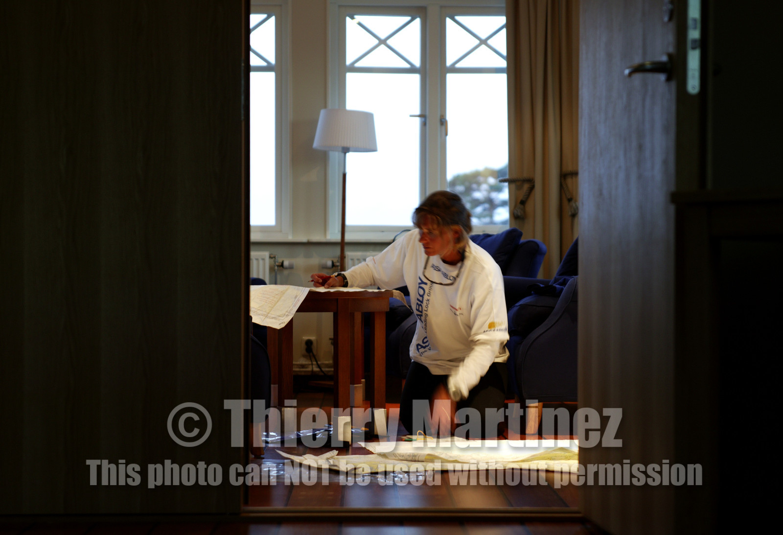 03_3171D © Th.Martinez,STOCKHOLM SWEDEN, 8 07 03-Archipelago Raid (2003). day1. .Lisa McDonald (UK) ASSA ABLOYpreparing navigation of Leg2 .