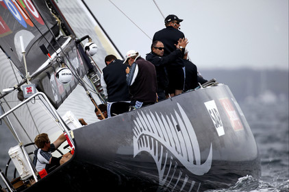 03_0242D ©Th.Martinez - Auckland (NZ) . America's Cup 2003. 20th February 2003. Day 4 Cancelled..Alinghi (SUI 64) vs Team NZ (NZL 82) .Team NZ's skipper Dean Barker at the helm of NZL 82, with frenchman Bertrand Pace (Tactician, on place of Hamish Pepper) for first time on board for America's Cup. Bertrand Pace is the first French sailor to race in n America's Cup match and is the helmsman of NZL 81. The race had been cancelled for wind not enough stable. Race 4 should start on Saturday 22th February...