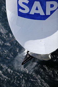 03_0198D ©Th.Martinez - Auckland (NZ) . America's Cup 2003. 18th February 2003. Day 3..Alinghi (SUI 64) vs Team NZ (NZL 82) .Team NZ's bowman droping head sail in 2nd Downwind leg...