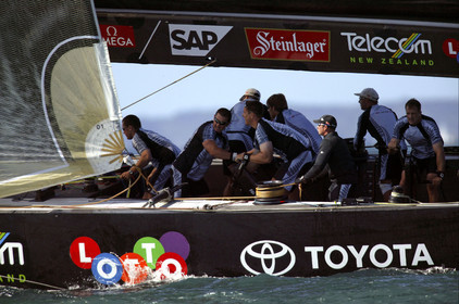 03_0211D ©Th.Martinez - Auckland (NZ) . America's Cup 2003. 18th February 2003. Day 2..Alinghi (SUI 64) vs Team NZ (NZL 82)  NZL 82's crew trimming Genoa after downwind mark...