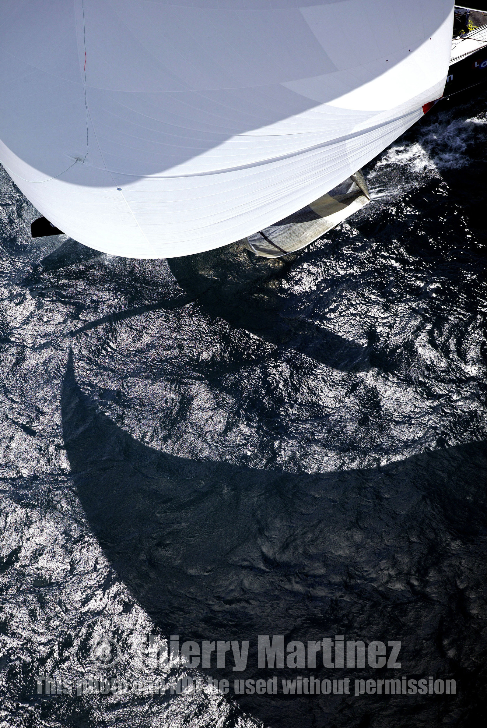 03_0199D ©Th.Martinez - Auckland (NZ) . America's Cup 2003. 18th February 2003. Day 3..Alinghi (SUI 64) vs Team NZ (NZL 82) .NZL 82 in last downwind leg...
