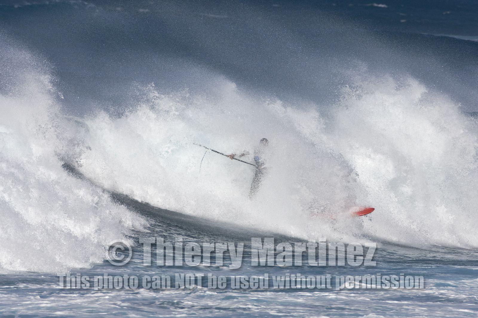 Stand Up Paddle  in waves at Hookip'a Beach - North Shore Maui - Hawaii.