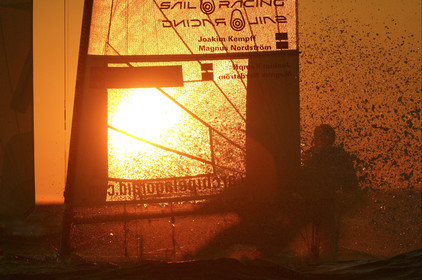 03_3252D © Th.Martinez,STOCKHOLM ARCHIPELAGO SWEDEN, 10 07 03-Archipelago Raid (2003)  Day 3..Team NOKIA-Kempff  Magnus Nordstrom (SWE)& Joakim Kempff (SWE) sailing in sunset light on the way back from Finland to Sweden.