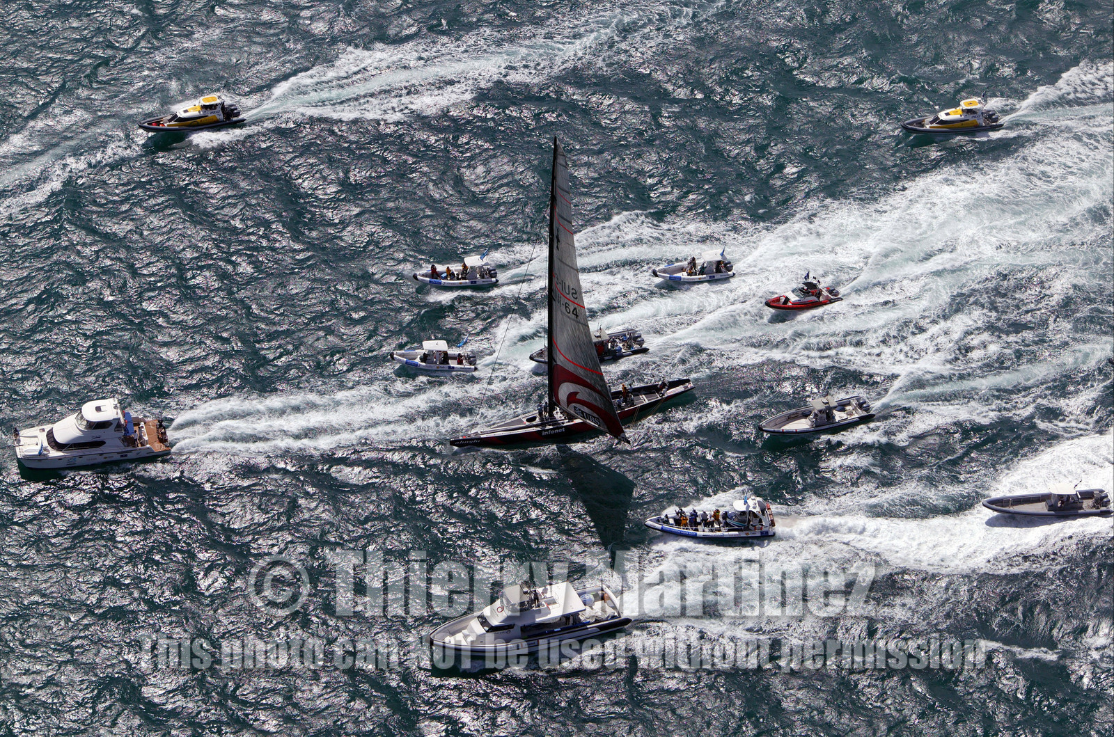 03_0967D © Th.Martinez . Auckland   New Zealand. 18th February 2003 America's Cup 2003, Day 3 Alinghi(SUI64) vs Team New Zealand(NZL82) Boat fleet folowing Alinghi team after thier victory on race 3