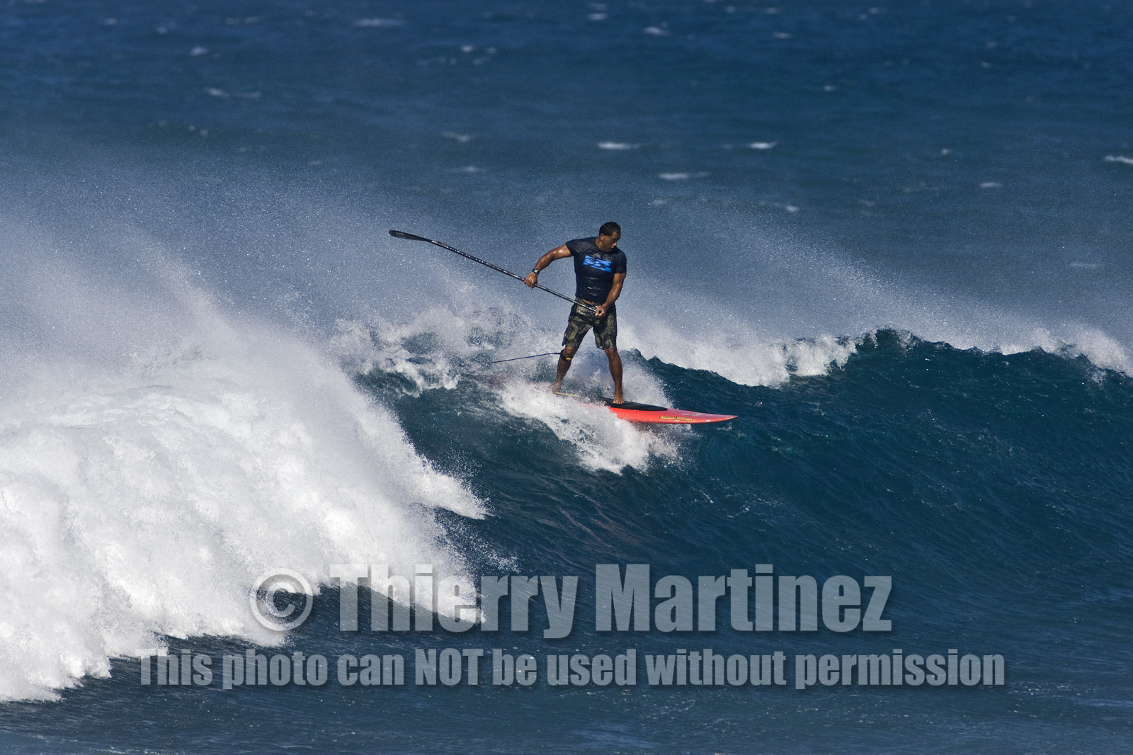 Stand Up Paddle  in waves at Hookip'a Beach - North Shore Maui - Hawaii.
