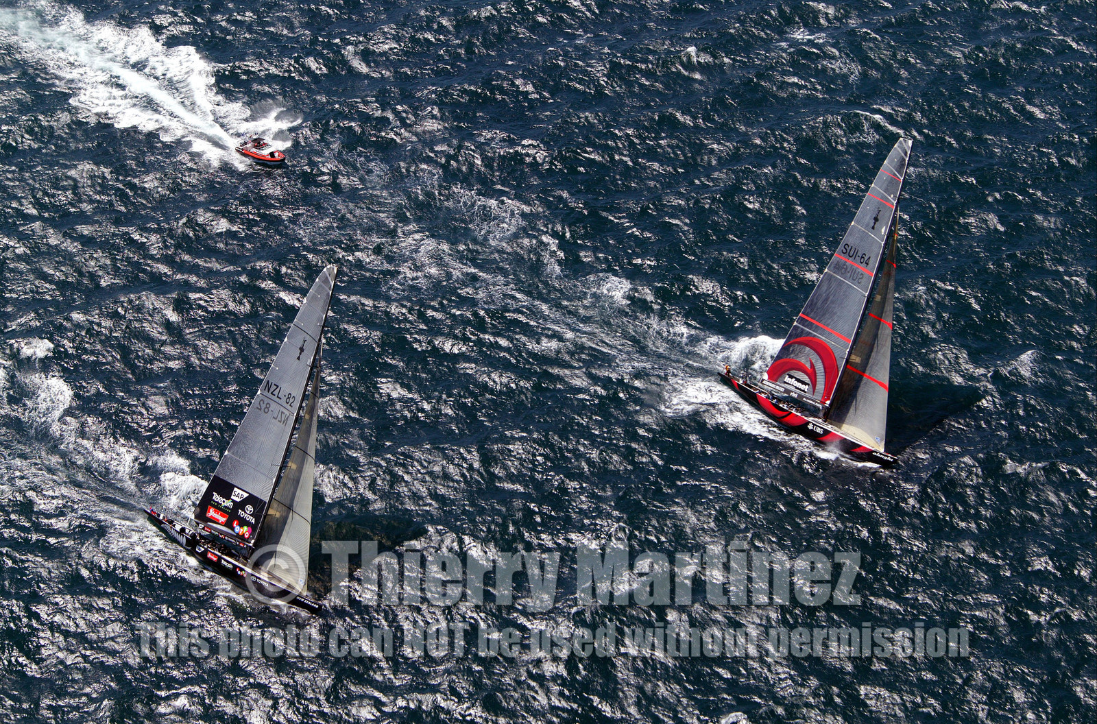 03_0892D © Th.Martinez. Auckland   New Zealand. 15 02 03 America's Cup Day 1.Alinghi (SUI64) vs Team New Zealand (NZL82) SUI64 setting up the pace in the beggining of the first upwind leg.