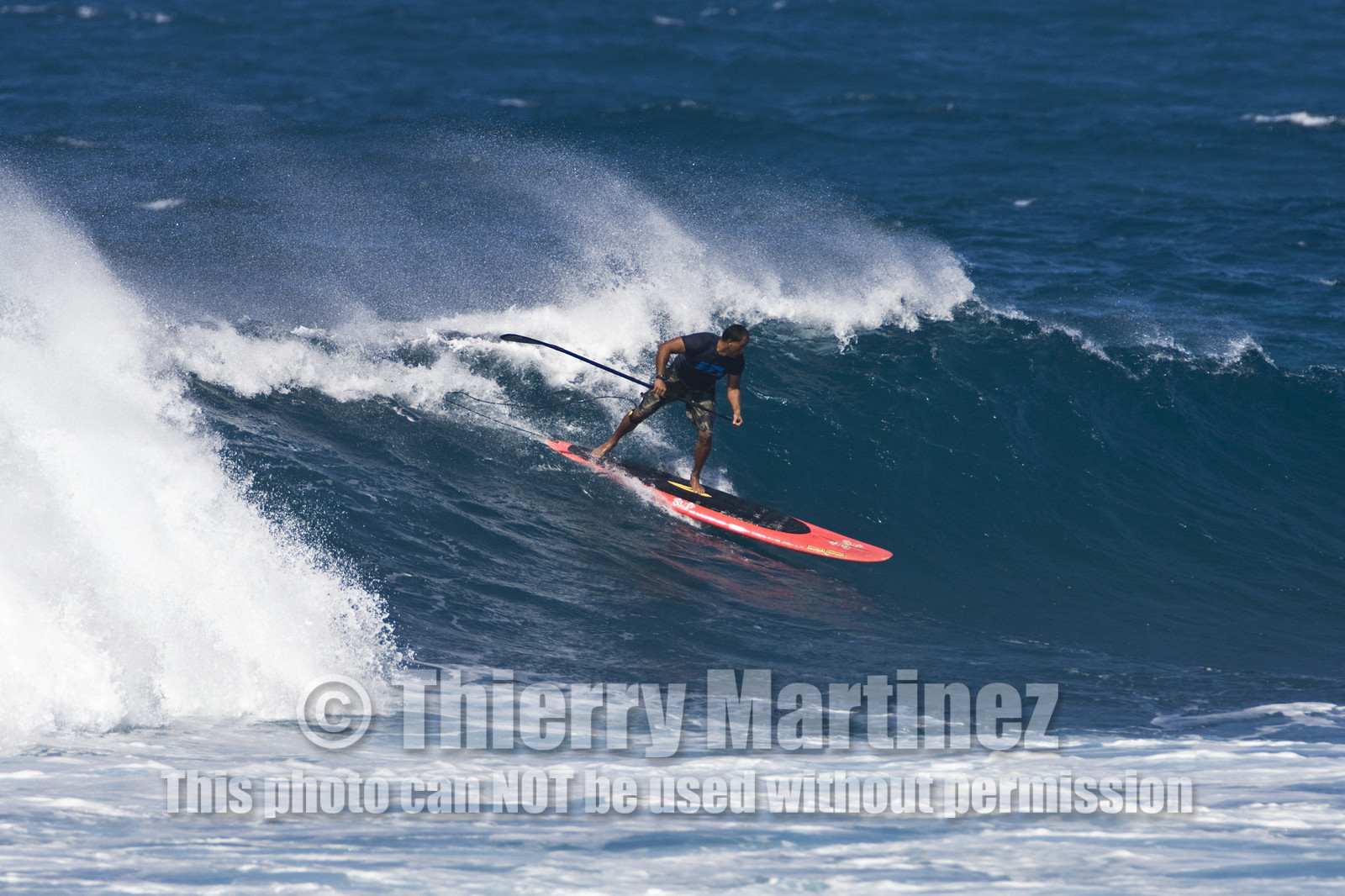 Stand Up Paddle  in waves at Hookip'a Beach - North Shore Maui - Hawaii.