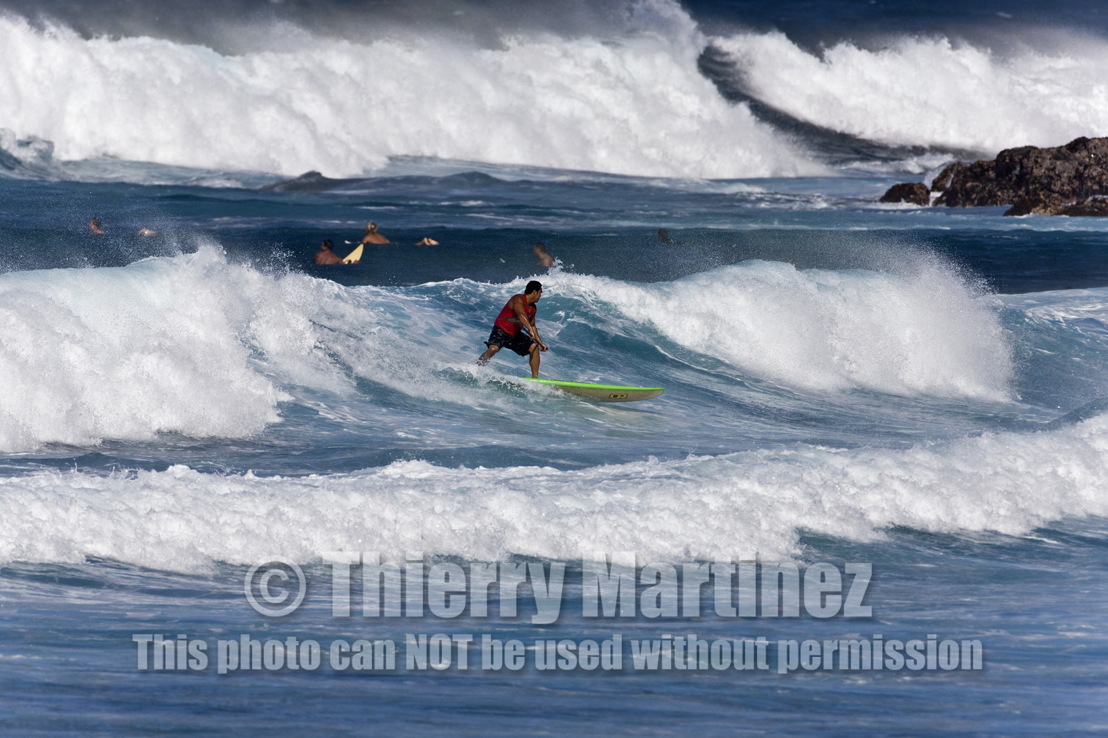 Stand Up Paddle  in waves at Hookip'a Beach - North Shore Maui - Hawaii.