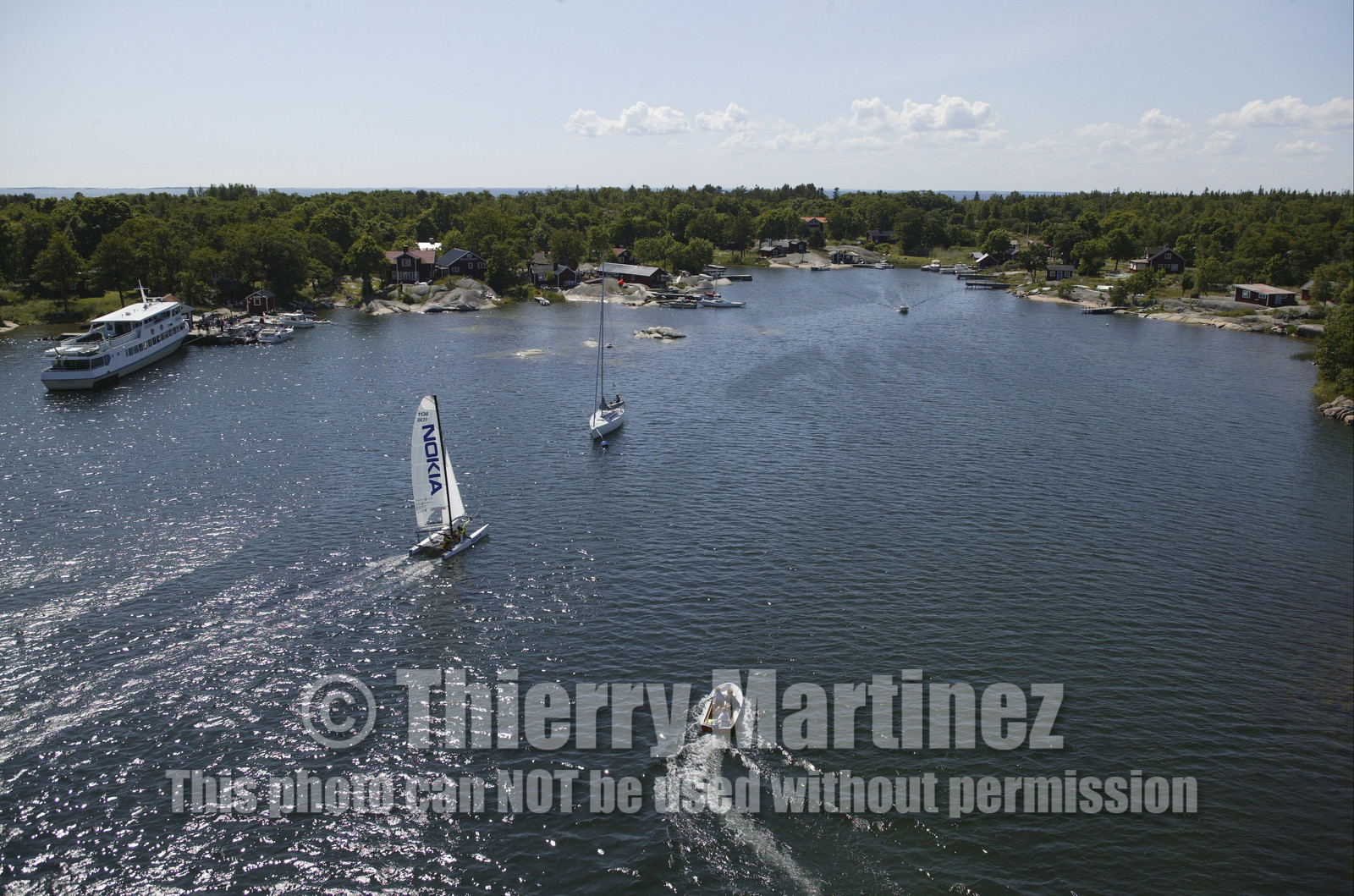 03_3158D © Th.Martinez,STOCKHOLM ARCHIPELAGO-SWEDEN9 07 03-Archipelago Raid (2003)  Leg 2.Team NOKIA arriving at RODLOGA check point.