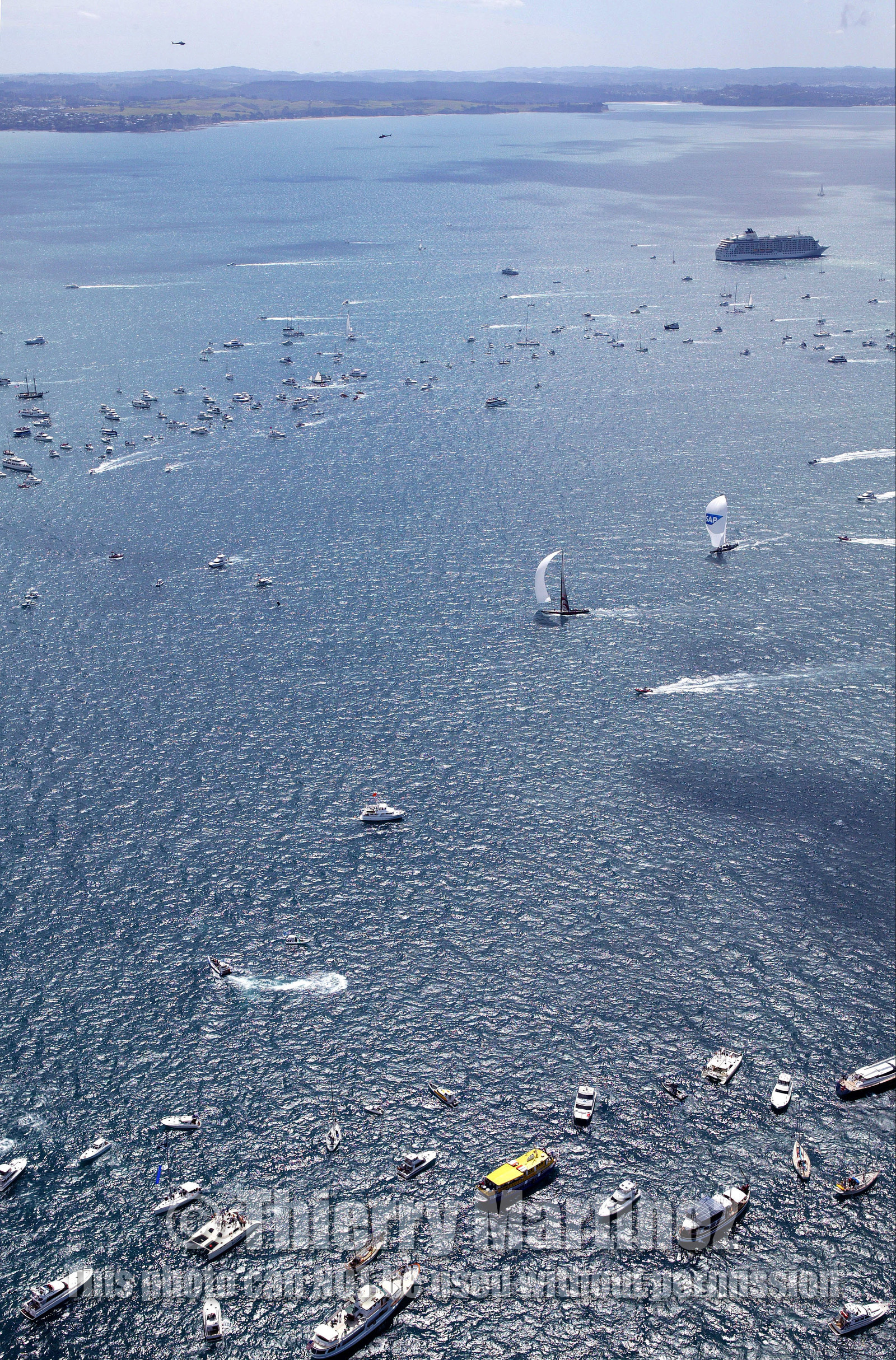 03_0965D © Th.Martinez . Auckland   New Zealand. 18th February 2003 America's Cup 2003, Day 3 Alinghi(SUI64) vs Team New Zealand(NZL82) Finish line of race day 3.