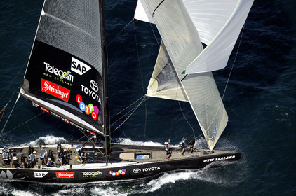 03_0195D ©Th.Martinez - Auckland (NZ) . America's Cup 2003. 18th February 2003. Day 3..Alinghi (SUI 64) vs Team NZ (NZL 82) .Team NZ 's crew droping head sail after setting up spinnaker at upwind mark...