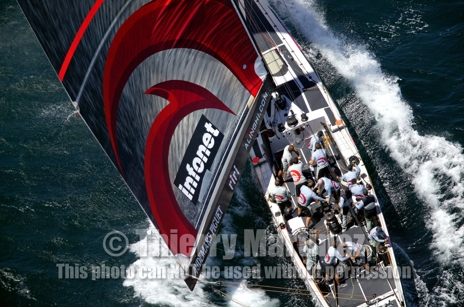 03_0906D © Th.Martinez. Auckland   New Zealand. 15 02 03 America's Cup Day 1.Alinghi (SUI64) vs Team New Zealand (NZL82) Alinghi crew working hard to stay in front of Team New Zealand in the first upwind leg.