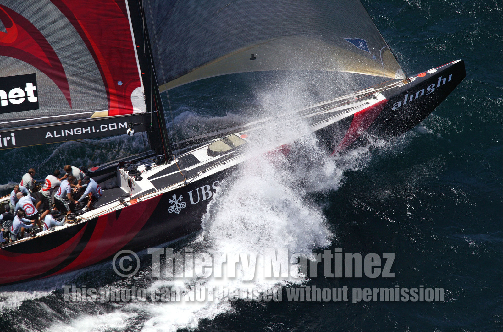 03_0909D © Th.Martinez. Auckland   New Zealand. 15 02 03 America's Cup Day 1.Alinghi (SUI64) vs Team New Zealand (NZL82) SUI64 heading to first mark alone, NZL82 retire from the the race after suffering gear damages.