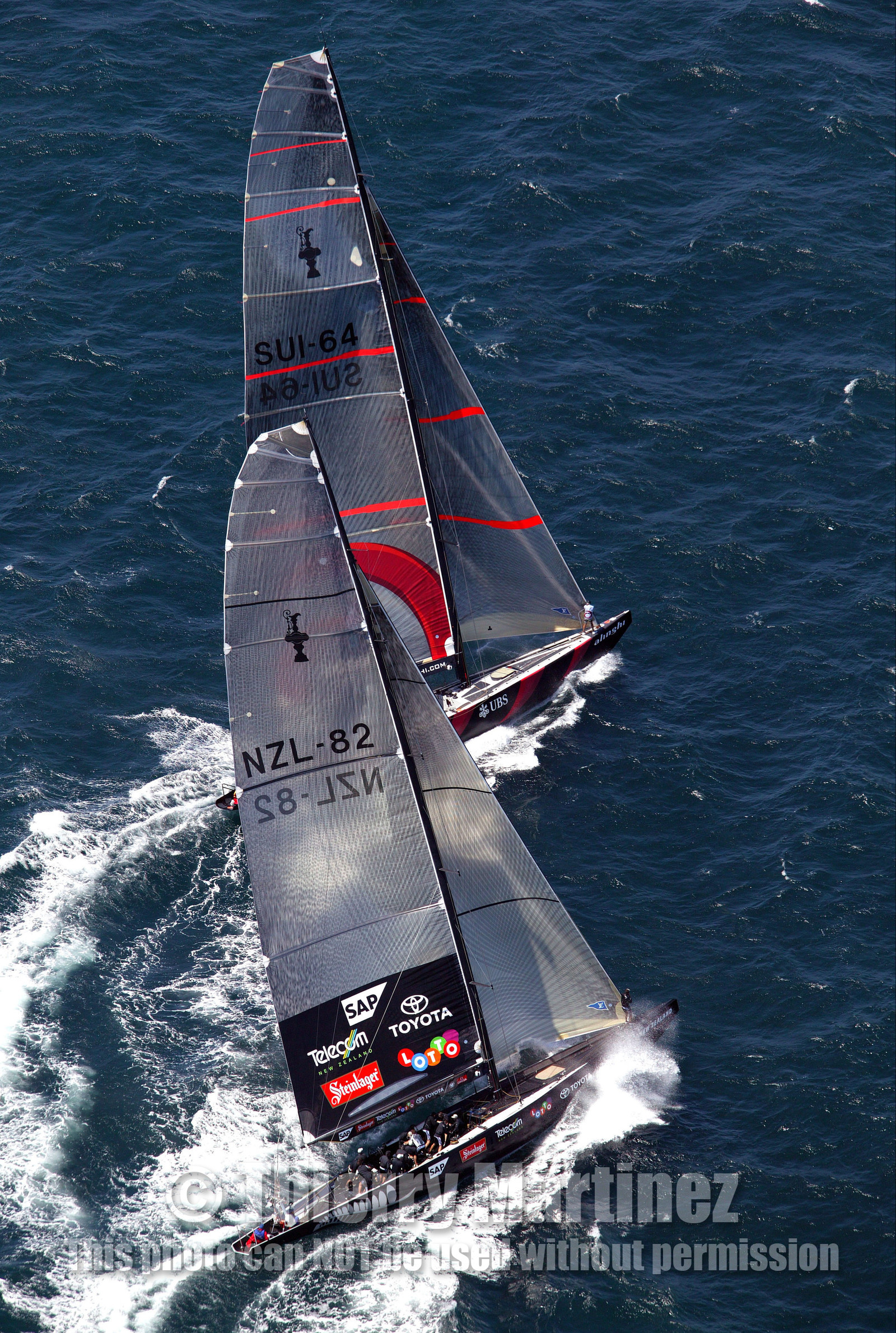 03_0885D © Th.Martinez. Auckland   New Zealand. 15 02 03 America's Cup Day 1.Alinghi (SUI64) vs Team New Zealand (NZL82) SUI64 leading on NZL82 just before the starting line.