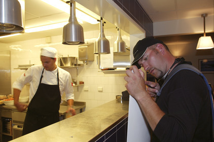 03_3172D © Th.Martinez,STOCKHOLM SWEDEN, 8 07 03-Archipelago Raid (2003).Nynäshamn..Stop in first HQ. Thomas Östergren (SWE) fixing his daggerboard in the kitchen of Nynäs-havsbad restauraunt.
