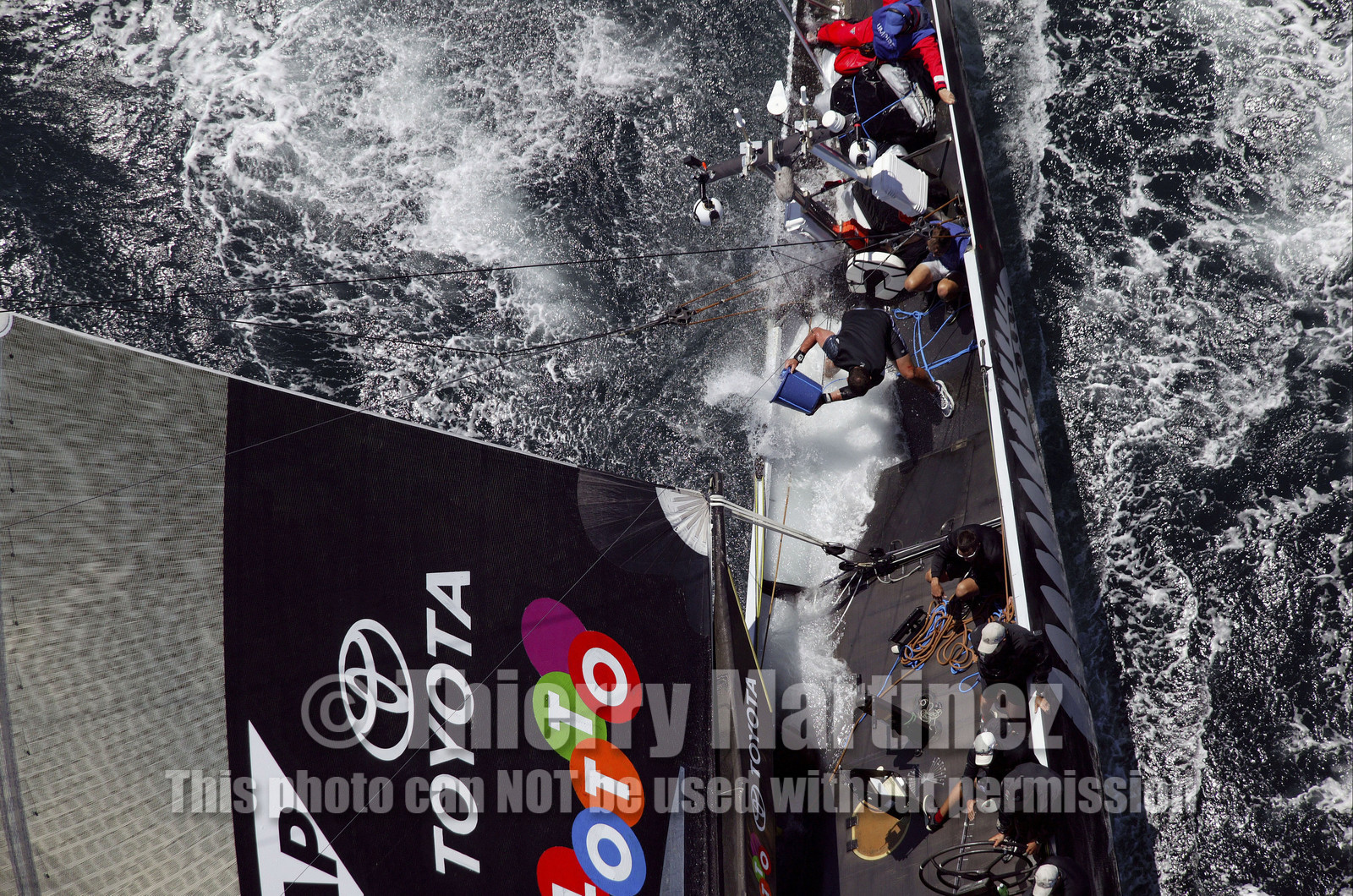 03_0176D ©Th.Martinez - Auckland (NZ) . America's Cup 2003. 15th February 2003. Day 1..Alinghi (SUI 64) vs Team NZ (NZL 82) .NZL 82 in first minutes of Race 1 before retiring on damage. Alinghi 1- Team NZ 0.