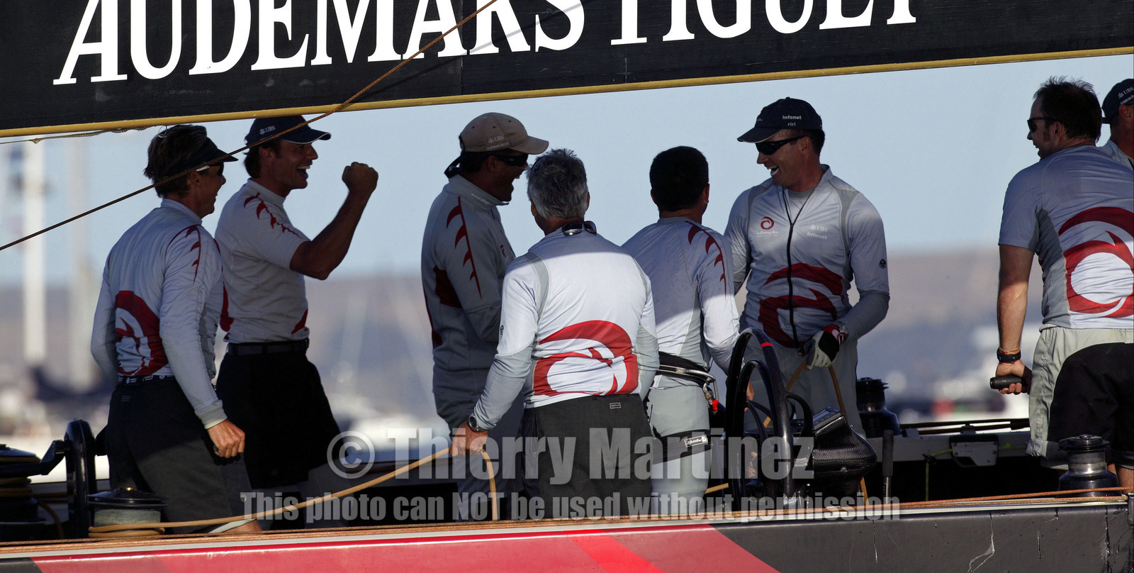 03_0960D © Th.Martinez  Auckland   New Zealand. 16 February 2003 America's Cup 2003, Day 2.Alinghi (SUI64) vs Team New Zealand (NZL82).Finish line - Alinghi's crew enjoy their second victory in a row , after a very close race against Team NZ.