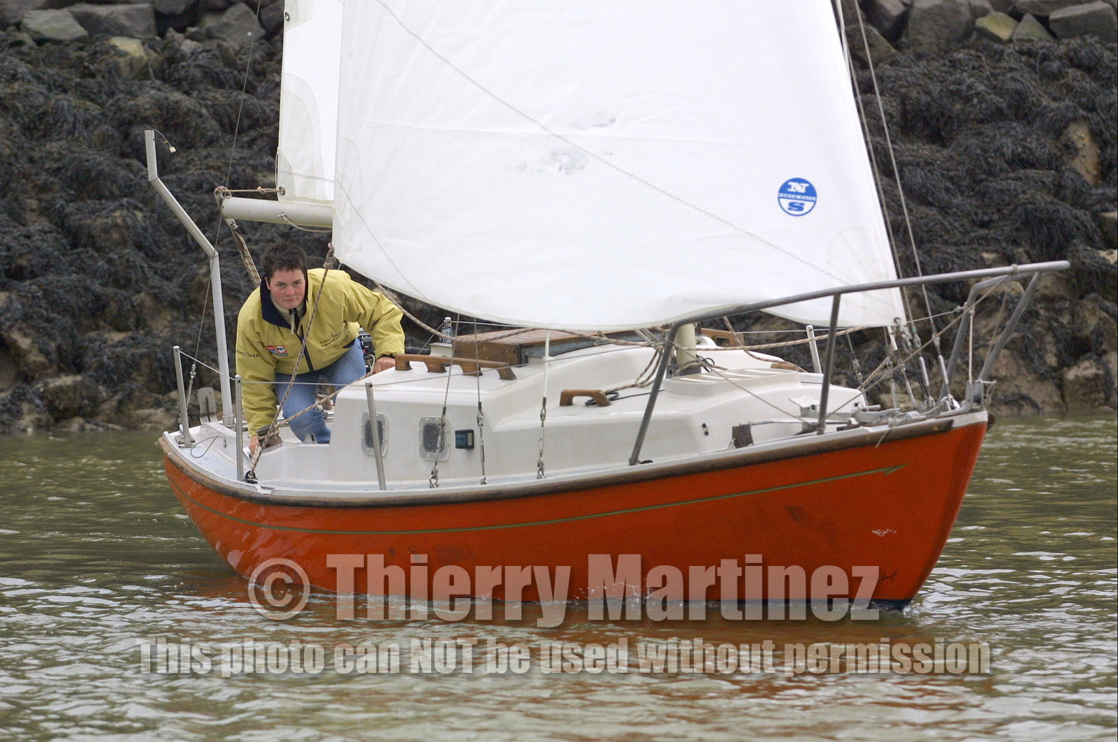 ©ThMartinez. Vendee Globe Finish..Ellen MacArthur (UK) KINGFISHER sailing on the small boat which she did round Briatin .when she was 16 years old. It's the first time since 5 years, she was ailing that boat..Ellen was very happy . Her team did a surprise to Ellen when they carries the boat from UK to .the Vendee Globe finish.