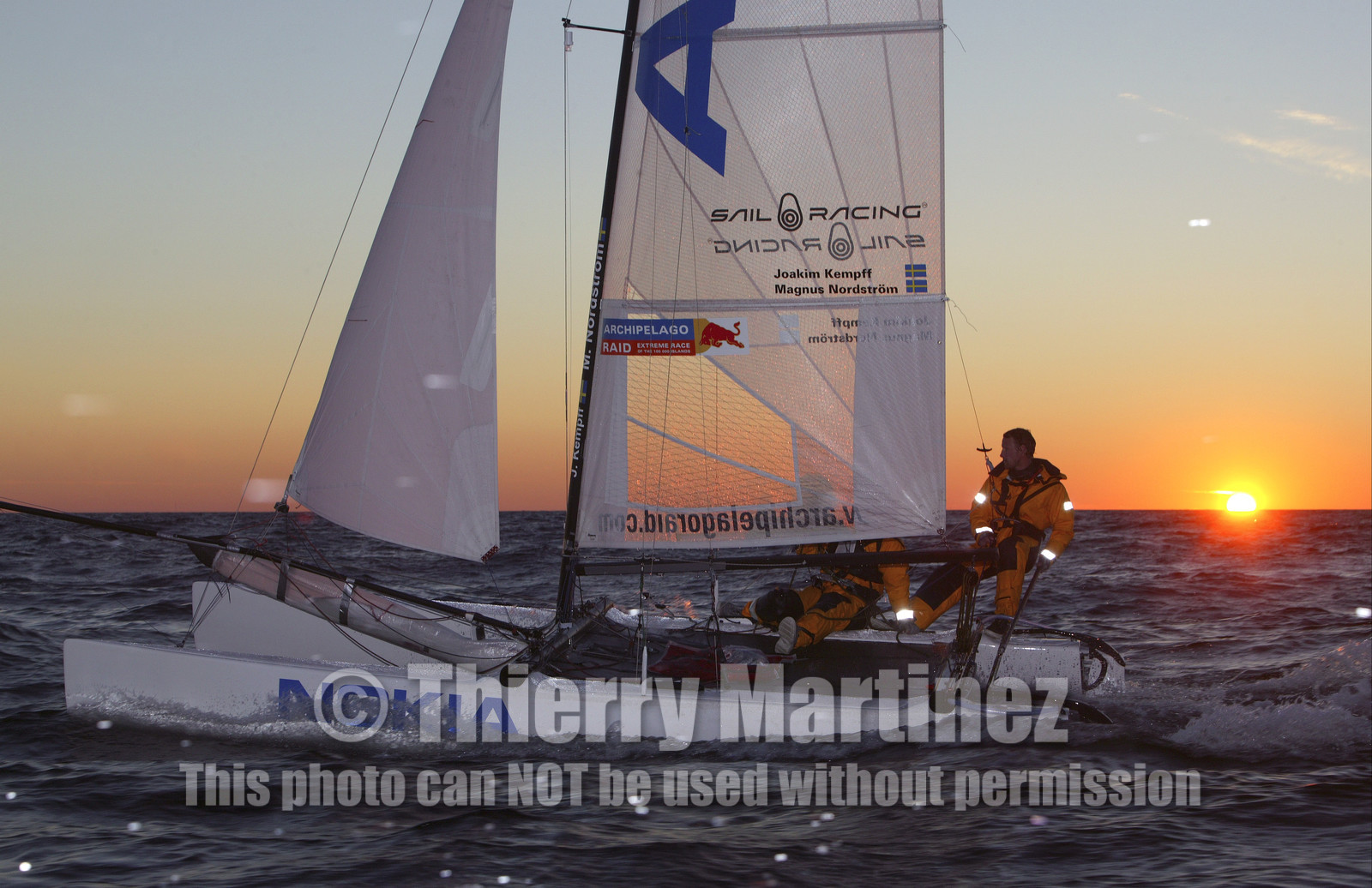 03_3256D © Th.Martinez,STOCKHOLMSWEDEN10 07 03-Archipelago Raid (2003).Leg4: Marieham (Finland) to Fejan (Sweden) . Team Nokia-Kempff in sunset light.