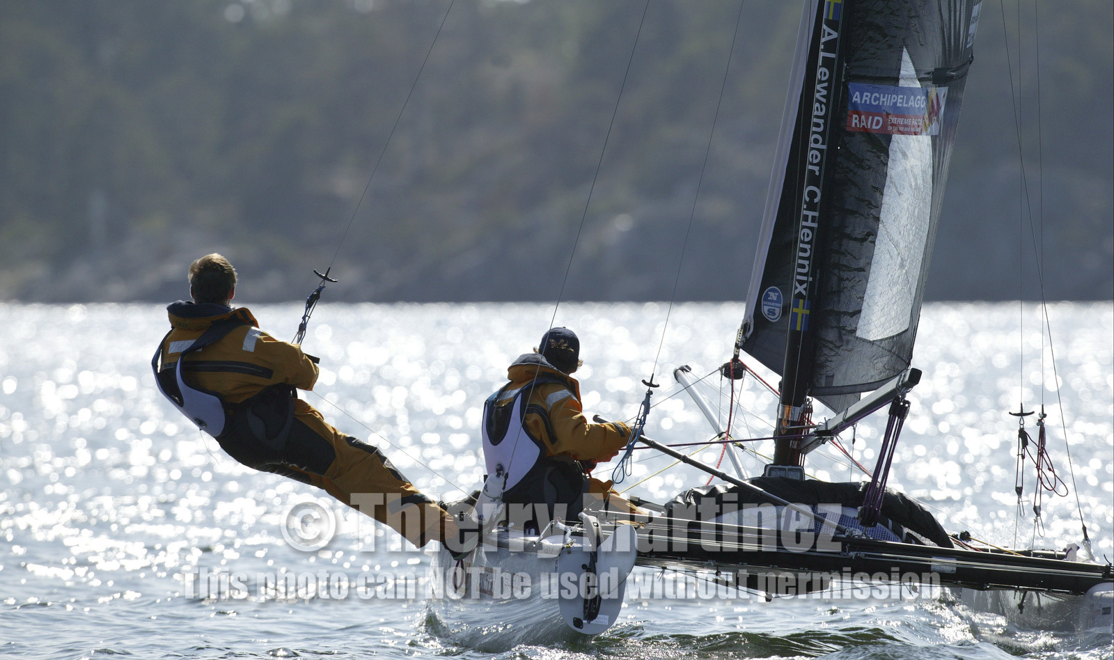 03_3065D © Th.Martinez,STOCKHOLM ARCHIPELAGO SWEDEN, 8 07 03-Archipelago Raid (2003)  Day 1..TIDERMANS   Anders Lewander (SWE)- at the helm and Calle Hendix (SWE)