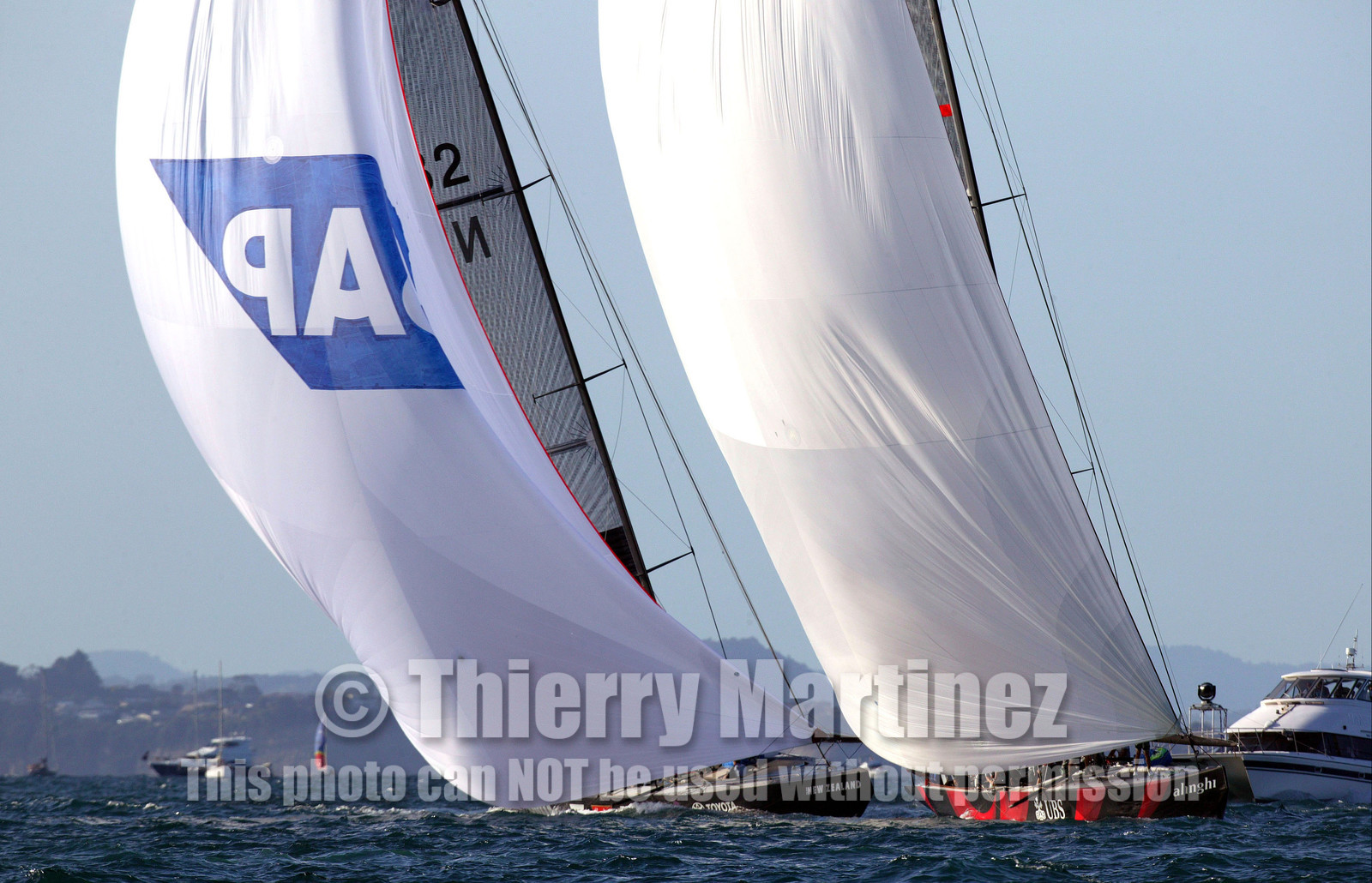 03_0955D © Th.Martinez  Auckland   New Zealand. 16 February 2003 America's Cup 2003, Day 2.Alinghi (SUI64) vs Team New Zealand (NZL82) Alinghi team manage to pass Team New Zealand few minutes before the finish line.