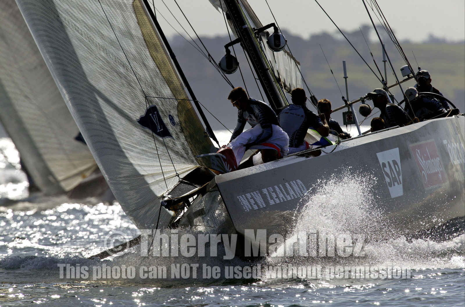 03_0214D ©Th.Martinez - Auckland (NZ) . America's Cup 2003. 18th February 2003. Day 2..Alinghi (SUI 64) vs Team NZ (NZL 82) .NZL 82 leading  SUI 64 at mark 3. Alinghi will over take Team NZ in the last leg and win with 7s on Team NZ...