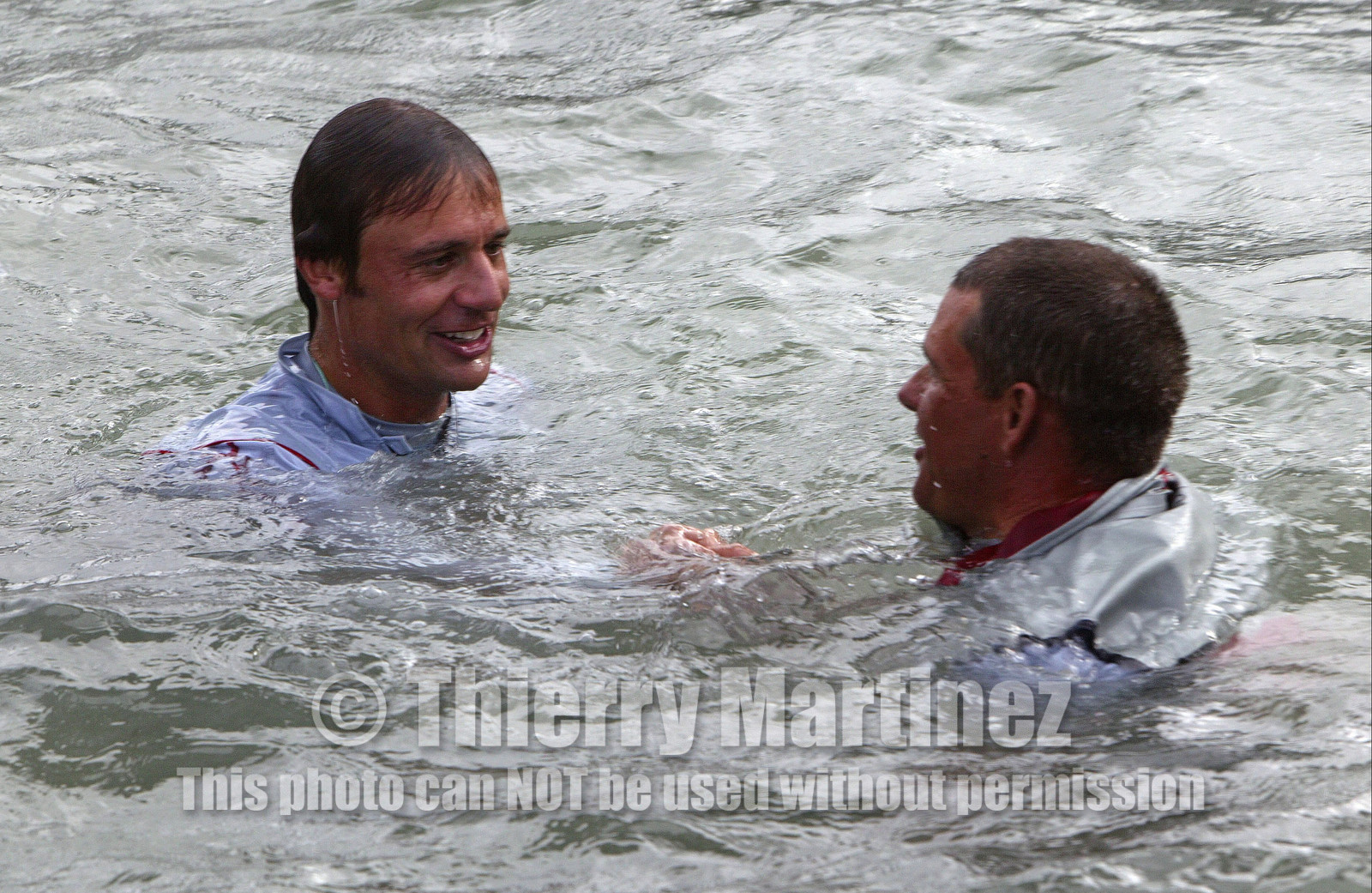 03_1501D ©Th.Martinez - Auckland (NZ) . America's Cup 2003. 2nd March 2003.Alinghi Team winner of America's Cup 2003..Ernesto Bertarelli and Dean Phipps in Vidauc Bassin water ...